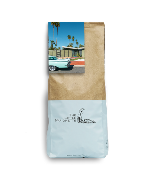 Bag of The Little Marionette Signature House Blend specialty coffee beans in branded packaging, hand-roasted in Sydney and made from ethically sourced beans with chocolate, caramel, and subtle fruit notes. 