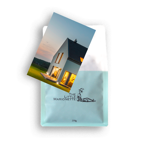 Bag of The Little Marionette Signature House Blend specialty coffee beans in branded packaging, hand-roasted in Sydney and made from ethically sourced beans with chocolate, caramel, and subtle fruit notes