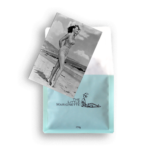 Bag of The Little Marionette Signature Legs 11 Blend specialty coffee beans in branded packaging, hand-roasted in Sydney and made from ethically sourced beans with balanced profile