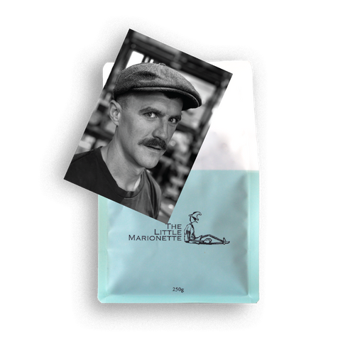 Bag of The Little Marionette Sanchez Blend specialty coffee beans in branded packaging, hand-roasted in Sydney and made from ethically sourced beans with dark chocolate, cherry and spice notes. 